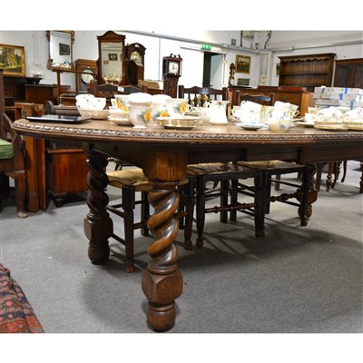 Lot 418 - A carved oak dining table, egg and dart moulded outline, tapering legs, 148cm x 108cm.