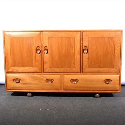 Lot 261 - A light elm sideboard by Ercol.