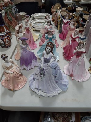 Lot 26 - A collection of Coalport bone china figures, ...