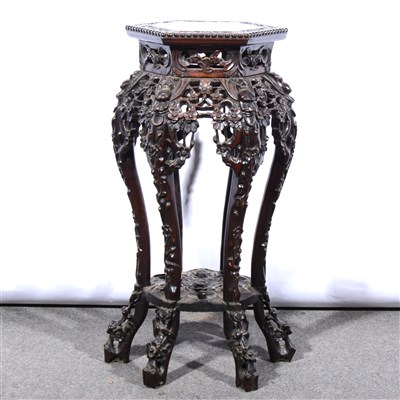 Lot 663 - A Chinese carved hardwood stand