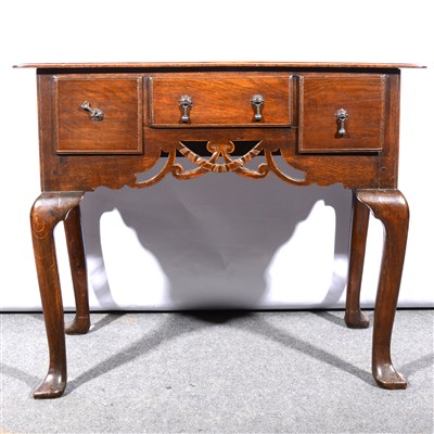 Lot 674 - An oak lowboy, 19th Century, rectangular top...