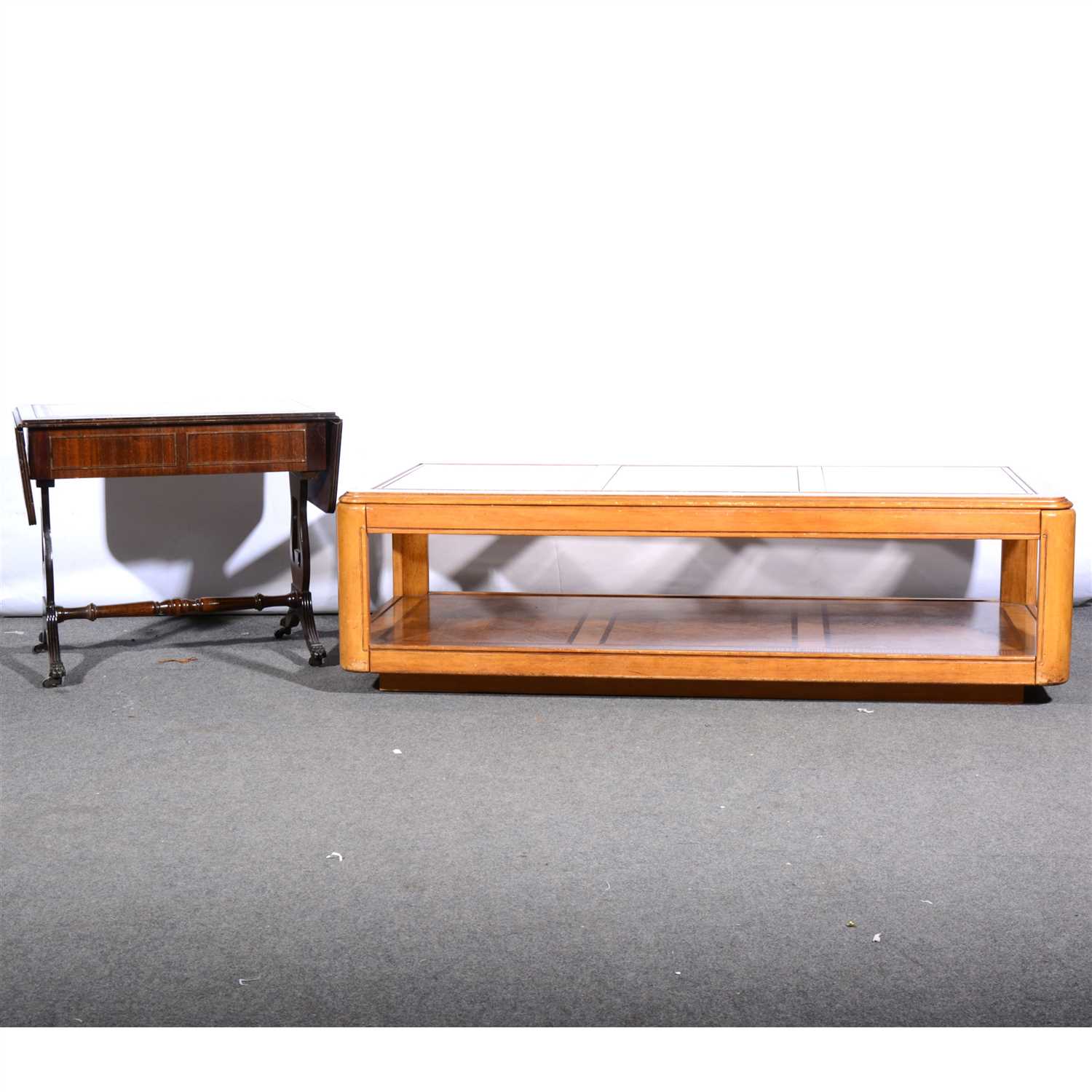 Lot 500 - A contemporary stained wood coffee table, ...