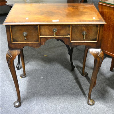 Lot 435 - A reproduction mahogany finish lowboy