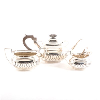 Lot 207 - A silver matched three-piece teaset