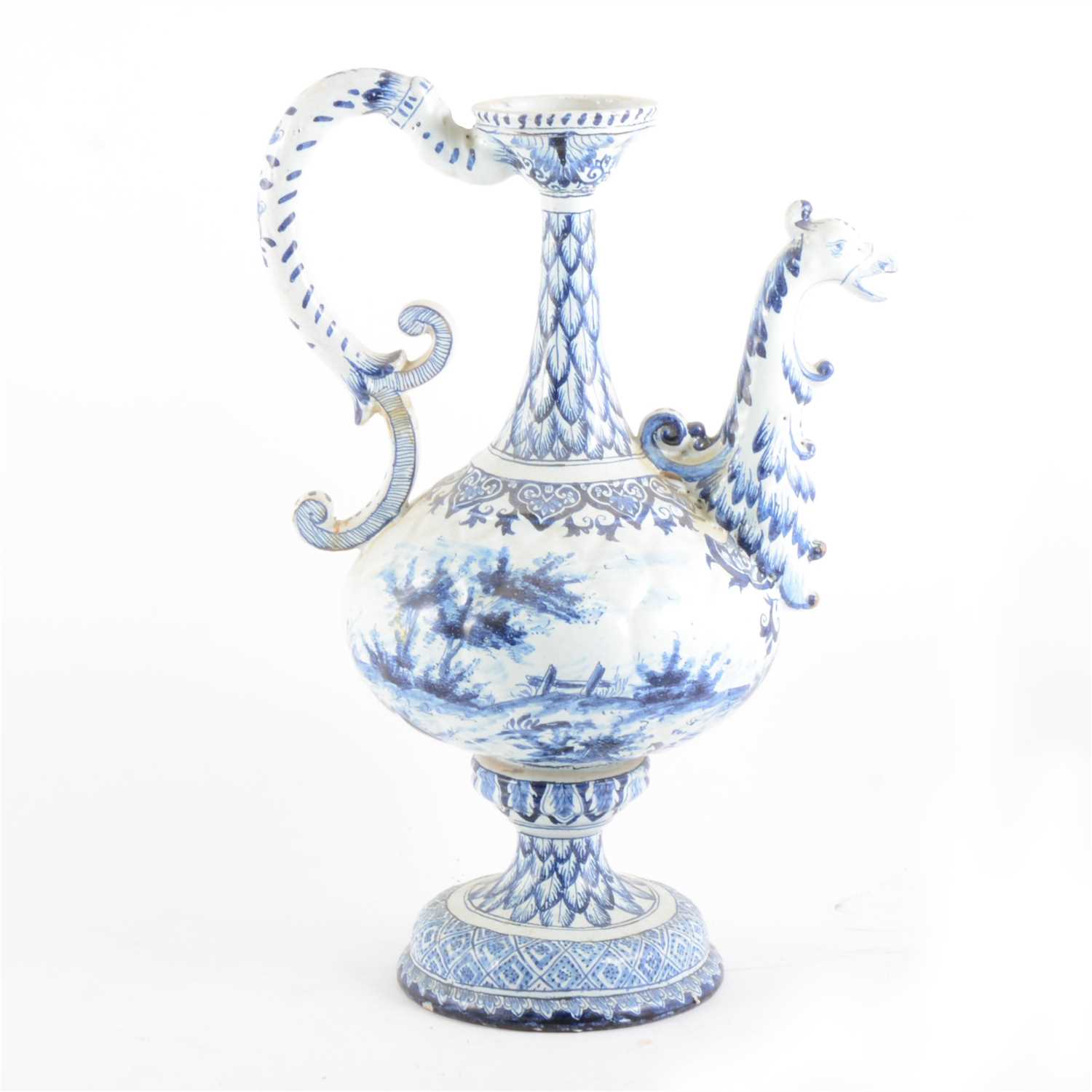 Lot 44 - A Dutch Delft blue and white ewer, griffin head handle