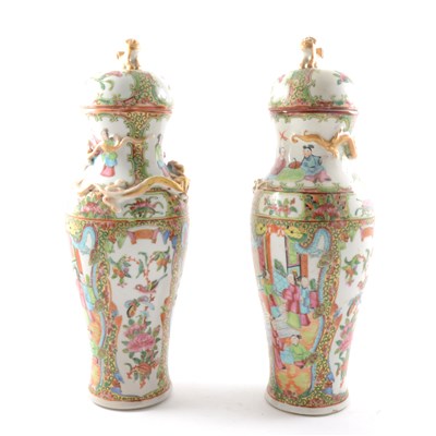 Lot 7 - A pair of Cantonese porcelain baluster shape covered vases