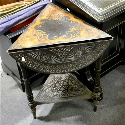 Lot 399 - A continental carved and stained wood triangular occasional table