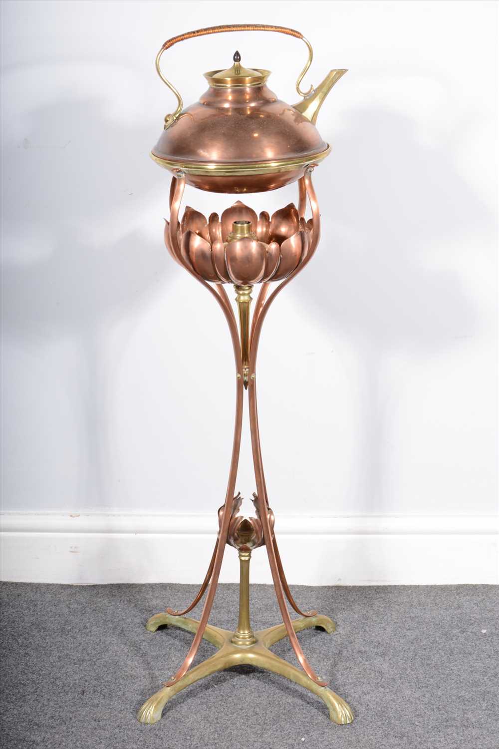 Lot 76 - An English Art Nouveau copper spirit kettle, attributed to W.A.S. Benson.