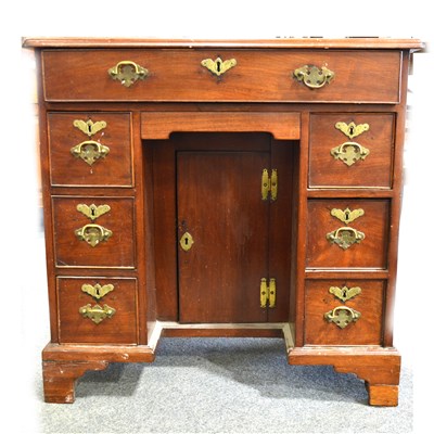 Lot 450 - George III mahogany kneehole dressing table