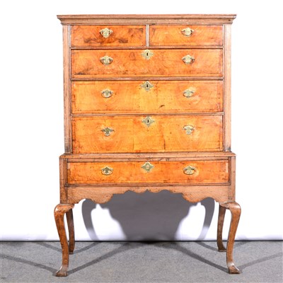 Lot 457 - A George II oak and walnut chest on stand, ...