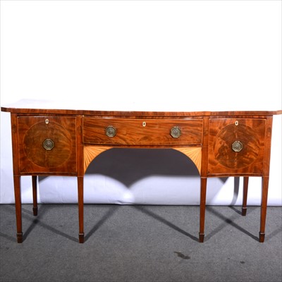 Lot 512 - A George III style mahogany serpentine sideboard