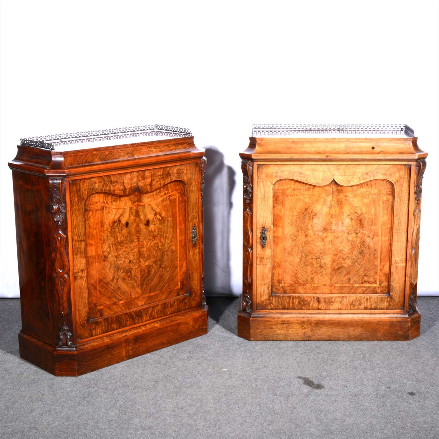 Lot 842 - A pair of Victorian figured walnut pier cabinets