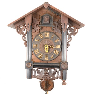 Lot 224 - A Black Forest type stained wood cuckoo clock, ...