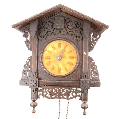 Lot 223 - A Black Forest type stained wood cuckoo clock, double weight driven, 40cm.