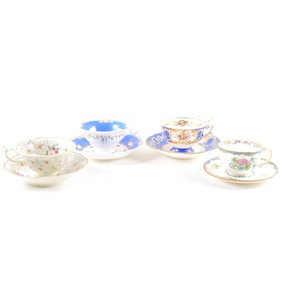 Lot 101 - A collection of decorative cups and saucers and trios.