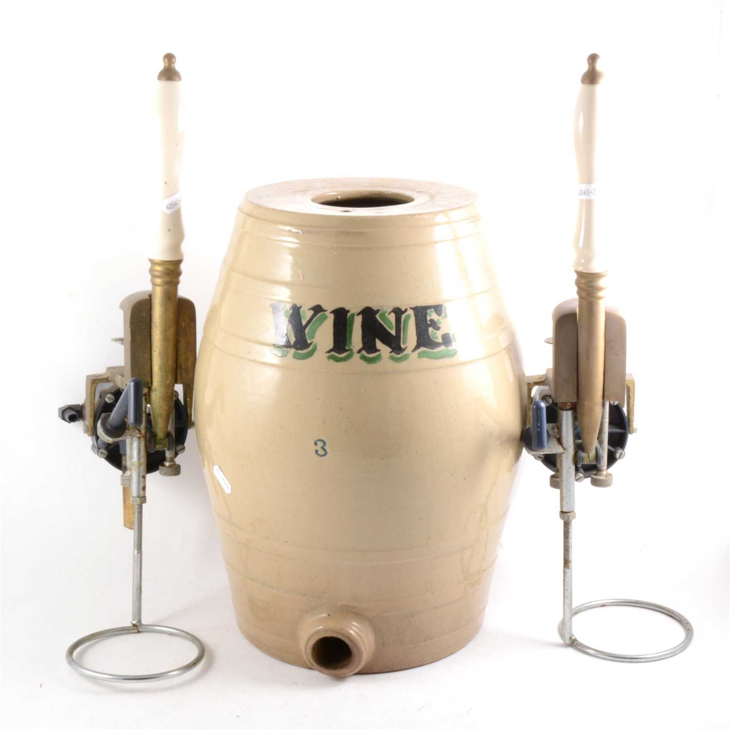 Lot 144 - Two beer pumps, and a stoneware wine barrel