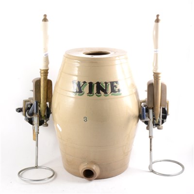 Lot 144 - Two beer pumps, and a stoneware wine barrel