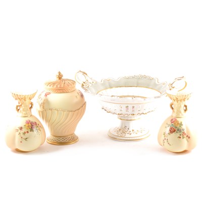 Lot 78 - A pair of blush ivory vases, a blush ivory pot pourri and a twin handled pedestal dish.