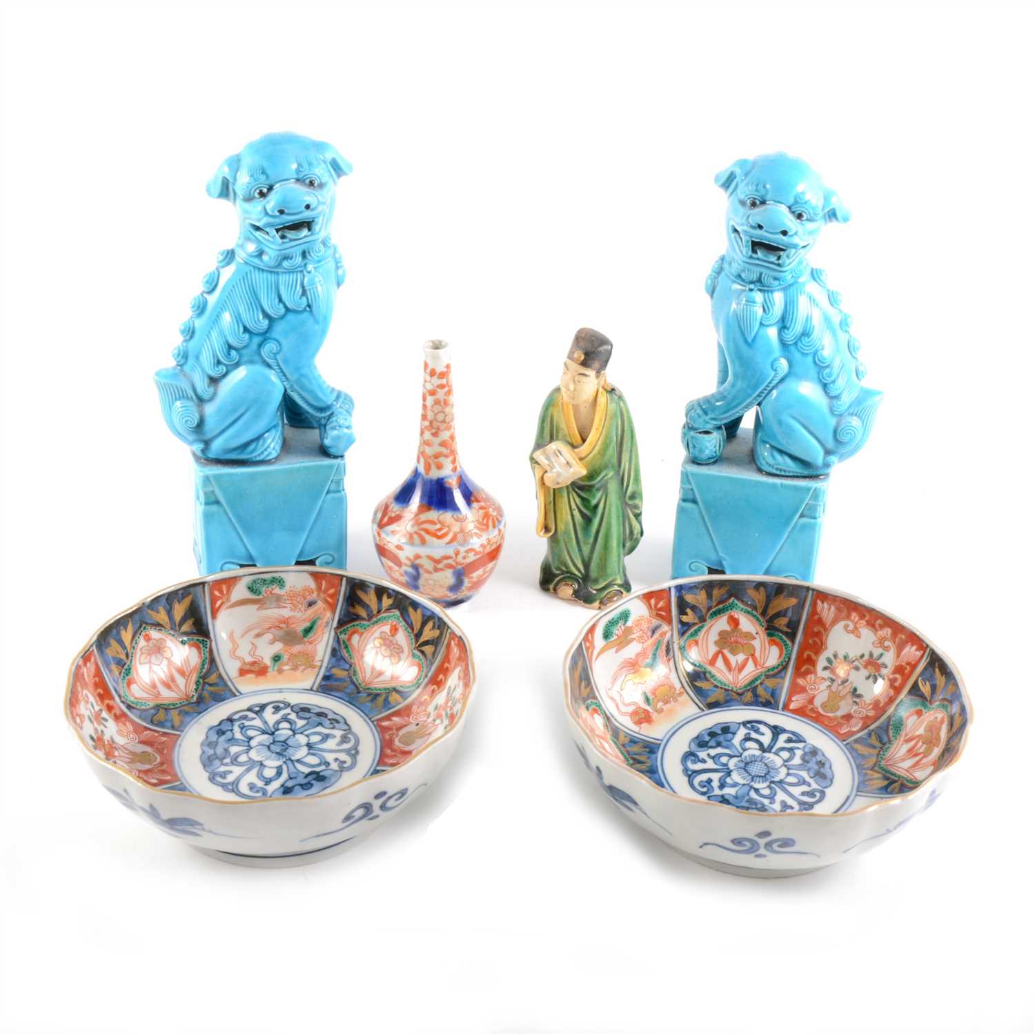 Lot 44 - A pair of Chinese turquoise glazed models of Temple Lions, ...