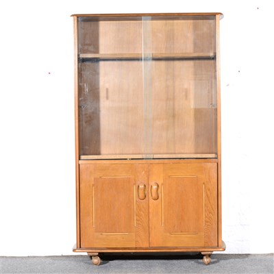 Lot 345A - Ercol style beech bookcase, the upper section...