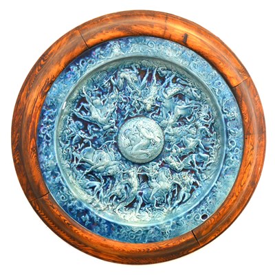 Lot 127 - A Roman pattern glazed earthenware shield-shaped plaque, ...