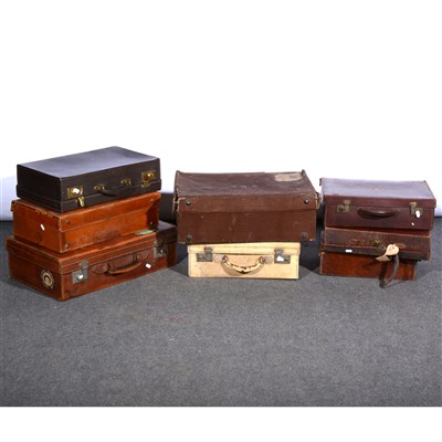 Lot 553 - A collection of five various leather suitcases, ...