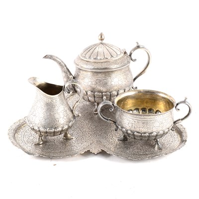 Lot 241 - A white metal three piece teaset with tray.