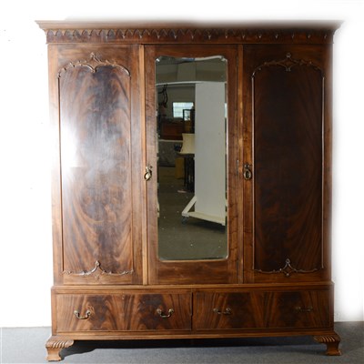 Lot 476 - A stained wood triple wardrobe,  ...