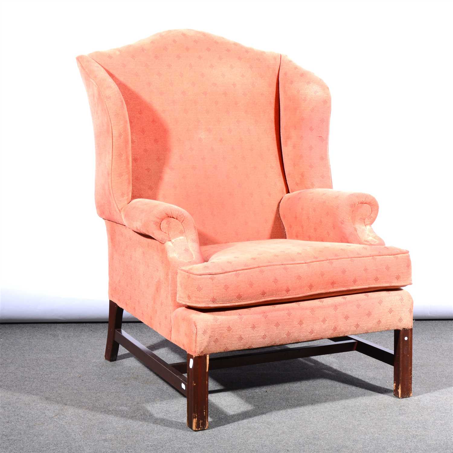 Lot 634 - A George III style wing-back easy chair,