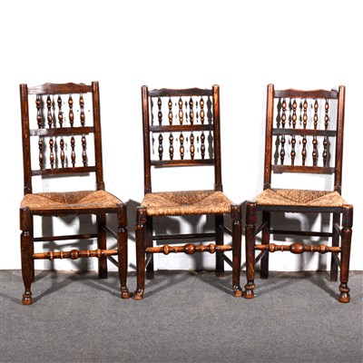 Lot 542 - Harlequin set of six mixed wood spindle back dining chairs,...