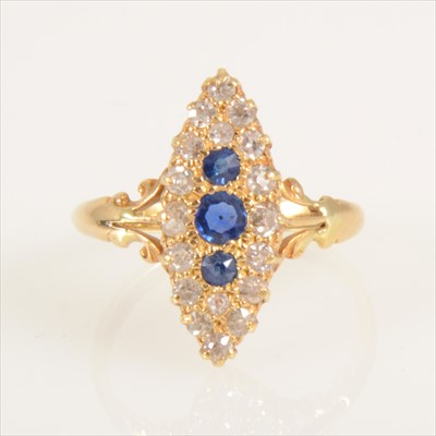 Lot 670 - A sapphire and diamond marquise cluster ring.