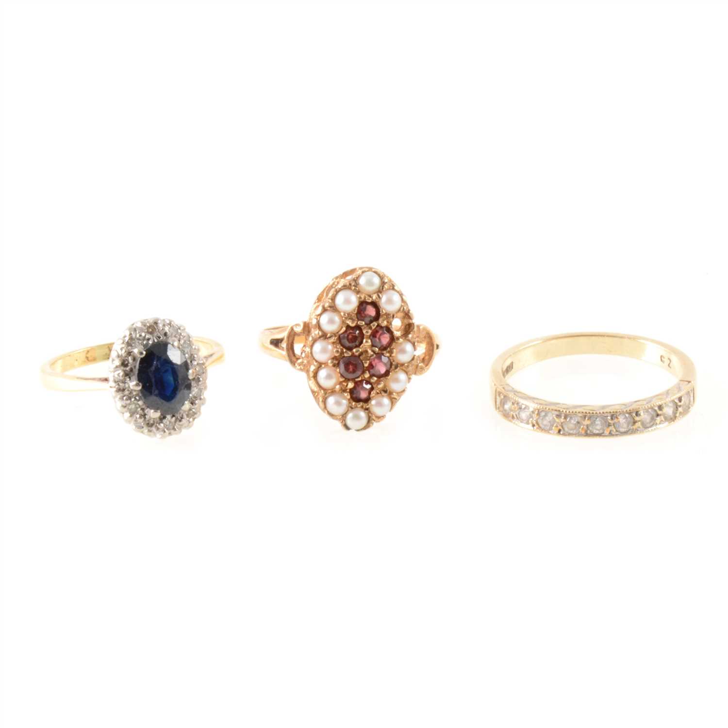Lot 287 - Three gemset rings, sapphire and diamond, cubic zirconia and garnet and pearl.