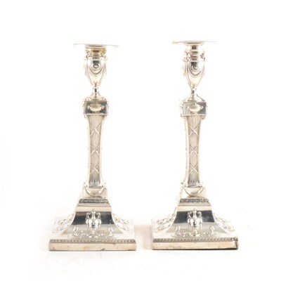 Lot 173 - A pair of silver of silver filled table candlesticks by William Comyns & Sons, London 1903