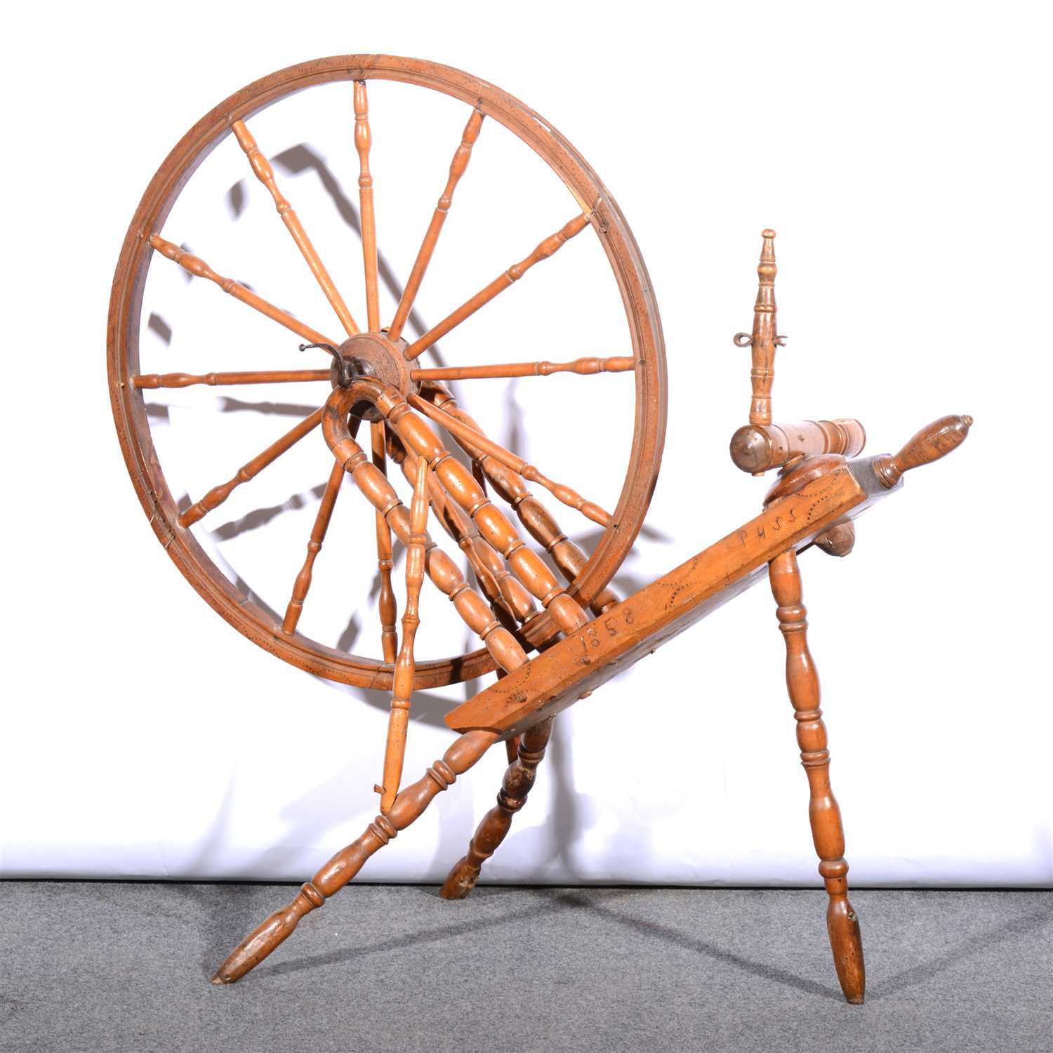 Lot 453 - Stained wood spinning wheel