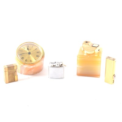 Lot 151 - A marble ashtray, clock and table lighter, carved pipe in fitted case, cigarette lighters