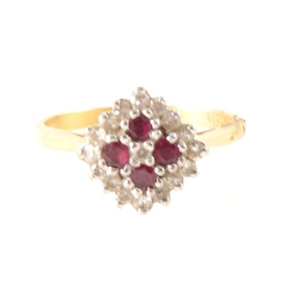 Lot 257 - A ruby and diamond cluster ring.