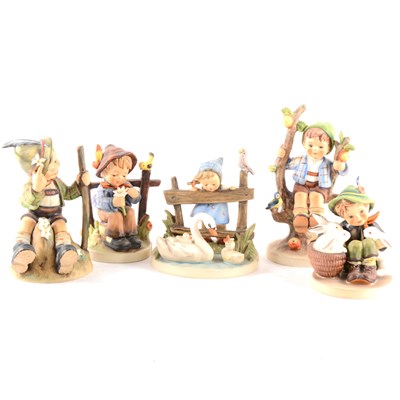 Lot 25 - A collection of Hummel figurines, including Apple Tree, Boy and Girl, ...