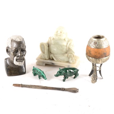 Lot 235 - A collection of Eastern figures and a Gaucho gourd and pipe