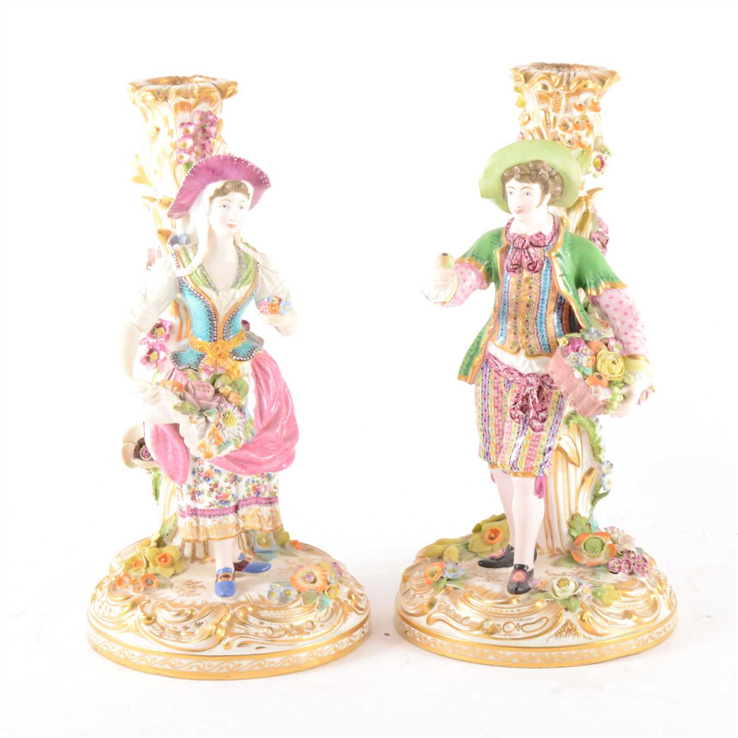 Lot 14 - A pair of English porcelain candlesticks, in the style of Stevenson & Hancock