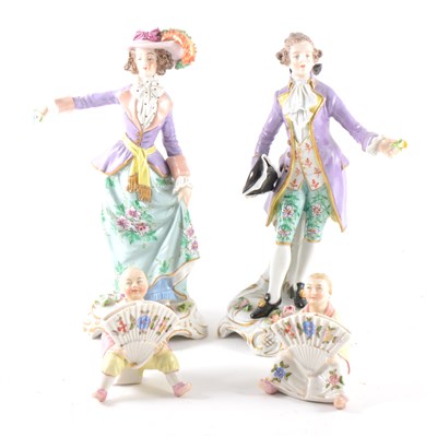 Lot 23 - A pair of Sitzendorf figures, and a pair of figural menu stands