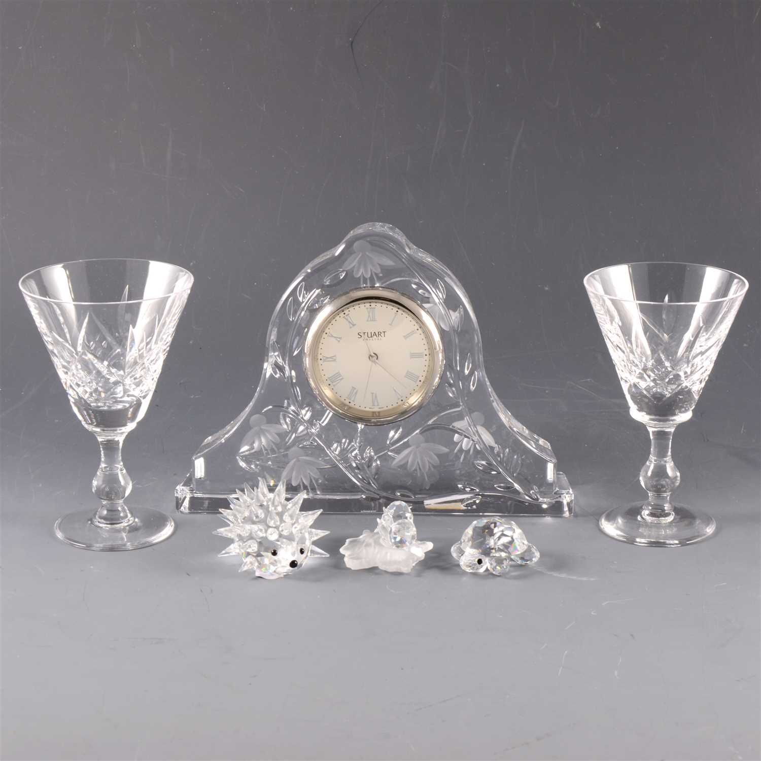 Lot 15 - A collection of glassware, including Waterford Crystal clock, Stuart Crystal clock and Swarovski miniatures