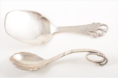 Lot 186 - A sterling silver preserve spoon, Georg Jensen, and another Danish silver spoon.