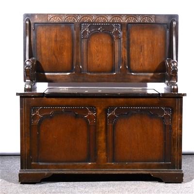 Lot 644 - A reproduction oak Monks bench