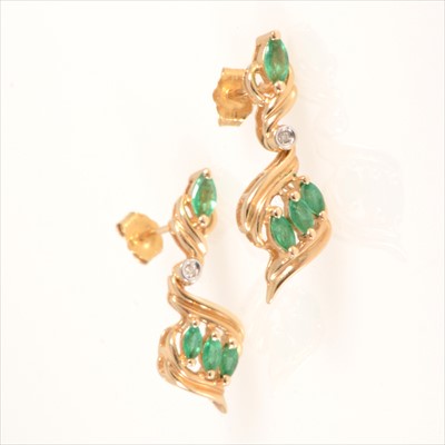 Lot 678 - A pair of emerald and diamond drop earrings.