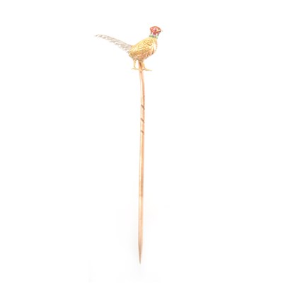 Lot 377 - A yellow and white metal pheasant stick pin.