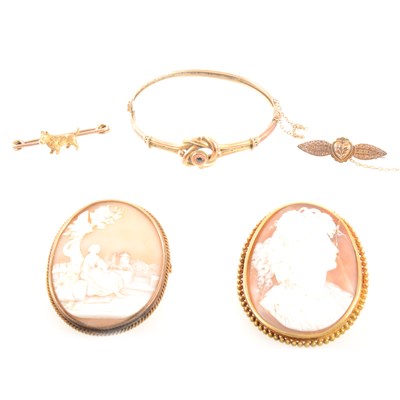 Lot 409 - Two cameo brooches, two bar brooches and a bangle