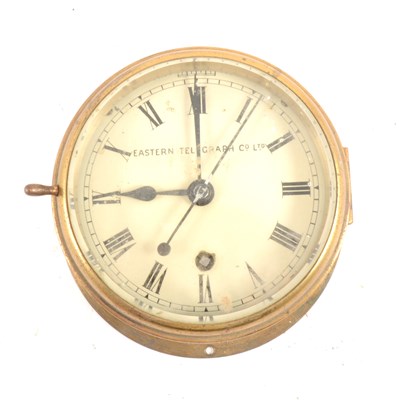 Lot 139 - A brass ship's clock, signed  Eastern Telegraph Co Ltd.