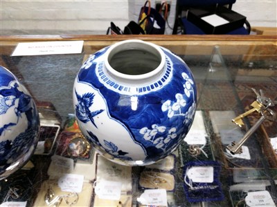 Lot 9 - A pair of Chinese blue and white ginger jars and covers.