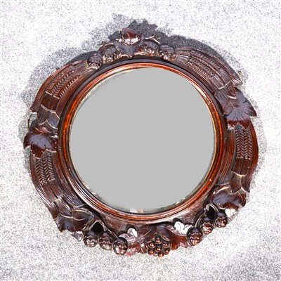 Lot 658 - Carved walnut cartouche-shape wall mirror