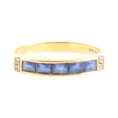 Lot 265 - A sapphire and diamond half eternity ring.